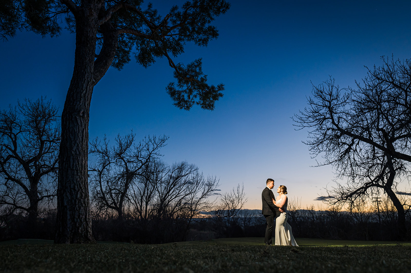 wellshire golf course wedding environment blue hour sunset photo dark and moody and dramatic with trees grass sky